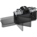 Mirrorless camera with adjustable LCD screen, ideal for photography enthusiasts.