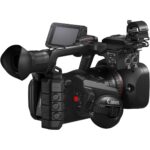 Canon professional video camera with lens and accessories, ideal for filmmakers and videographers.