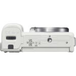 Bottom view of a white mirrorless camera body with lens mount, suitable for photography enthusiasts.