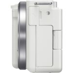 Side view of a white mirrorless camera body with lens mount, available at Camix UK.