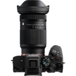 Sony mirrorless camera with Sigma zoom lens, top view, available at Camix UK.