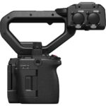 Professional cinema camera with handle and dual audio inputs, ideal for videography and filmmaking.