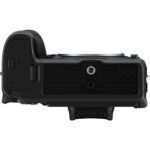Bottom view of a professional camera body with tripod mount.