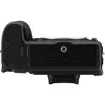 Bottom view of a professional camera body with tripod mount.