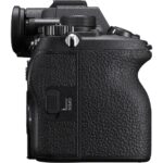 Side view of a black mirrorless camera body with textured grip, available at Camix UK.