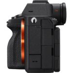 Side view of a mirrorless camera body with textured grip, available at Camix UK.