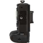Side view of a black camera body with grip, showcasing mount and controls.