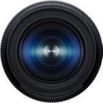 Close-up of a camera lens with blue reflections, ideal for photography enthusiasts.