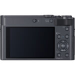 Back view of a compact digital camera with a large screen and control buttons.