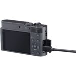 Back view of a compact digital camera with a cable connected, available at Camix UK.
