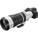Sony mirrorless camera with telephoto lens on display at a UK camera shop.