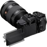 Sony mirrorless camera with lens and adjustable screen, ideal for photography enthusiasts.