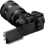 Sony mirrorless camera with lens and adjustable screen, ideal for photography enthusiasts.
