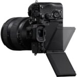 Professional mirrorless camera with adjustable screen and lens, available at Camix UK.