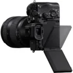 Professional mirrorless camera with adjustable screen and lens, available at Camix UK.