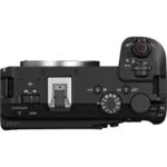 Top view of a Canon EOS R6 camera body with control dials and buttons.
