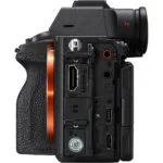 Side view of a mirrorless camera body with various ports and connections.
