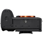 Top view of a mirrorless camera body without lens, showcasing mount and controls.