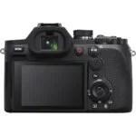 Back view of a mirrorless camera with LCD screen and control buttons, available at Camix UK.