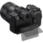 Mirrorless camera with adjustable screen and lens, available at Camix UK.