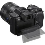 Mirrorless camera with adjustable screen and lens, available at Camix UK.