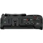 Top view of Nikon ZR camera with 24-200mm lens, featuring controls and display.