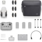 DJI drone with accessories including controller, batteries, and carrying case.