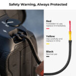 Camera safety warning with color-coded strap for protection.