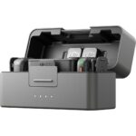 DJI microphone set in charging case, ideal for professional audio recording.