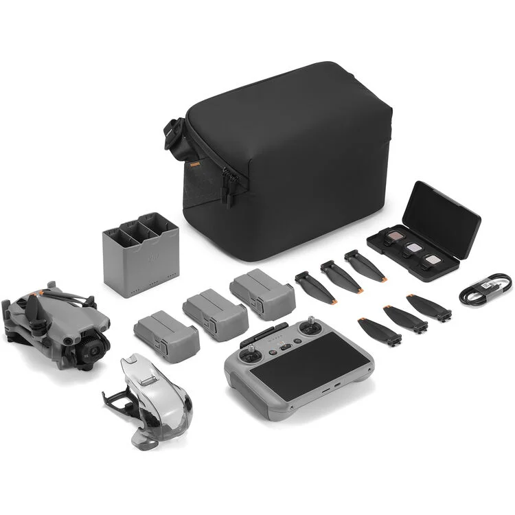 DJI drone with accessories including batteries, propellers, and carrying case from Camix camera shop UK.