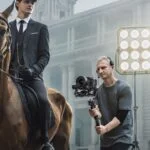 Man using DJI RS 3 Pro Gimbal Stabilizer for professional video shooting.